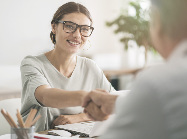 Woman in business meeting shaking hands. 