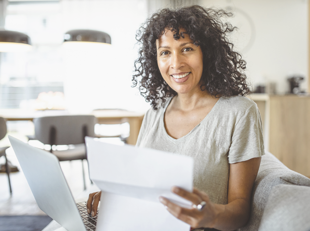 woman working from home smiling at camera