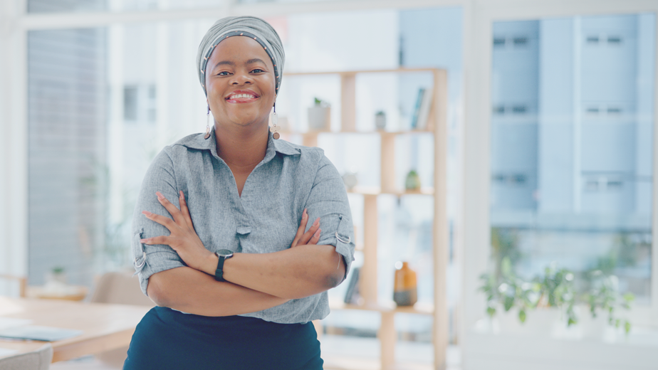 Portrait, arms crossed and happy black woman in office with smile, pride and senior startup business entrepreneur.