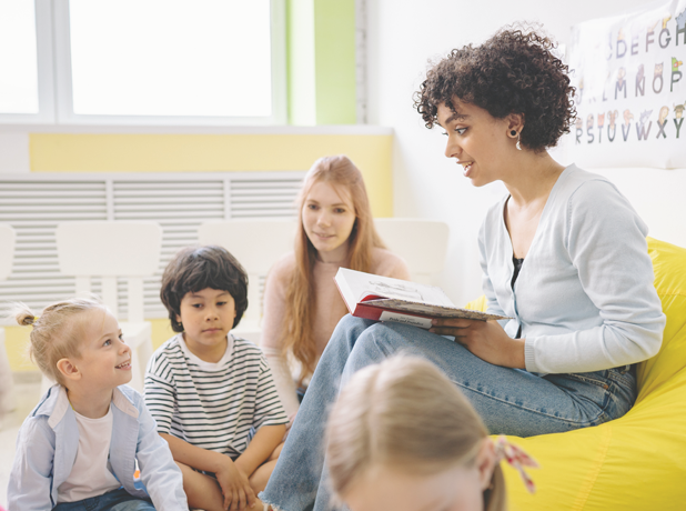 Woman reading to small children