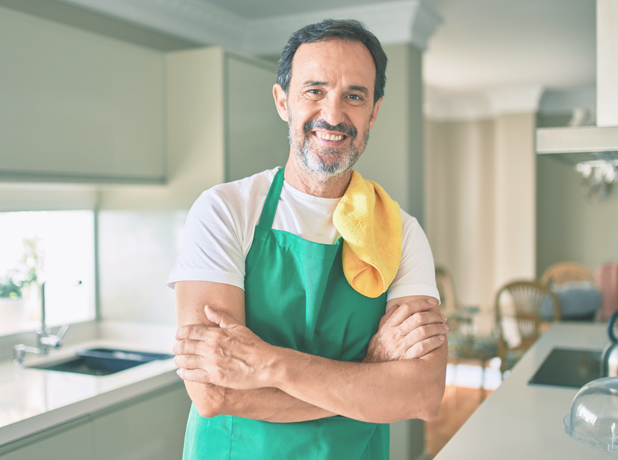 Man cleaning smailing at camera