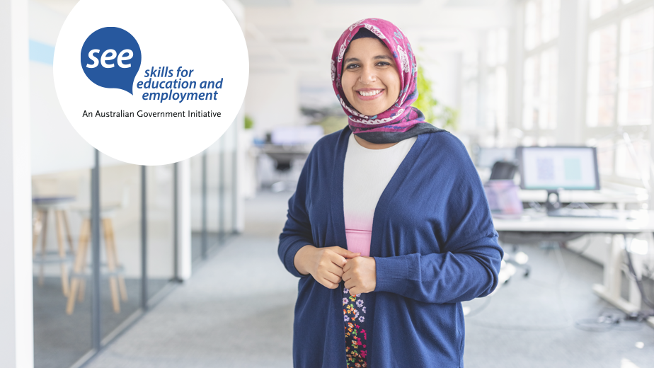 Portrait of happy mid adult Muslim woman standing at startup office